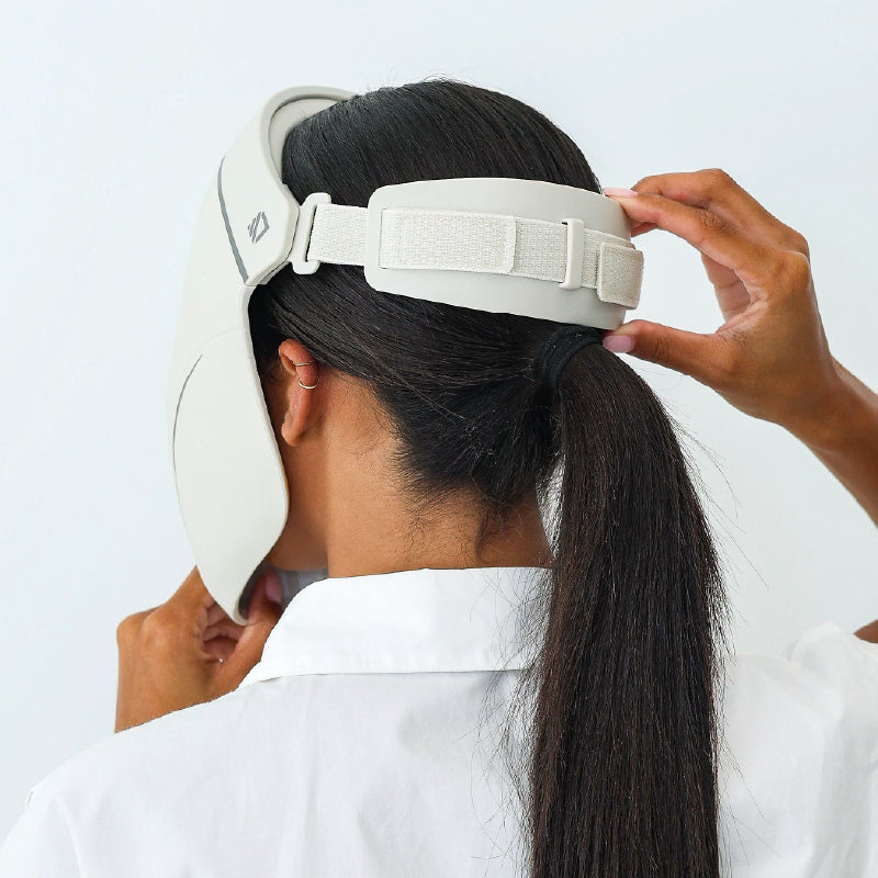 Adjusting the rear strap of the Dermalux LED Face Mask